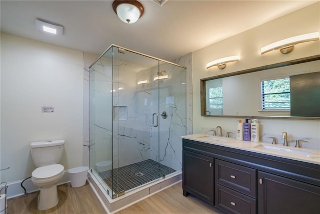 2316 Mountain Crest Pl, Gainesville, GA 30501 - bathroom with wood finished floors, toilet, double vanity, and a marble finish shower