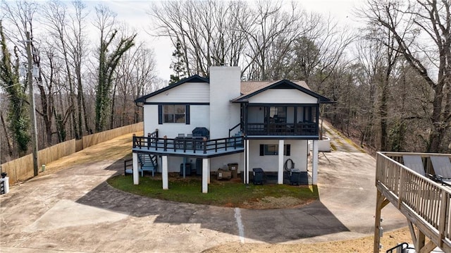 2316 Mountain Crest Pl, Gainesville, GA 30501 - back of house with stairs, concrete driveway, a deck, a chimney, and central air condition unit