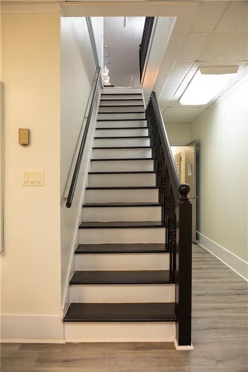 2316 Mountain Crest Pl, Gainesville, GA 30501 - staircase featuring baseboards and wood finished floors