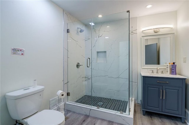 2316 Mountain Crest Pl, Gainesville, GA 30501 - full bath with toilet, wood finished floors, a marble finish shower, vanity, and recessed lighting