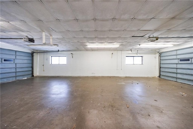 2316 Mountain Crest Pl, Gainesville, GA 30501 - garage featuring a garage door opener and concrete block wall