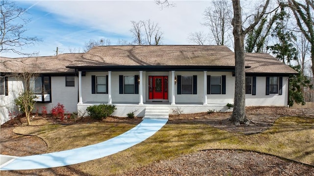 2316 Mountain Crest Pl, Gainesville, GA 30501 - ranch-style home featuring covered porch, brick siding, a front lawn, and roof with shingles
