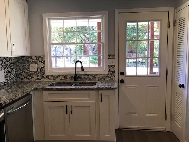 doorway with a wealth of natural light, sink, and dark hardwood / wood-style floors