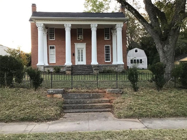 neoclassical / greek revival house featuring covered porch