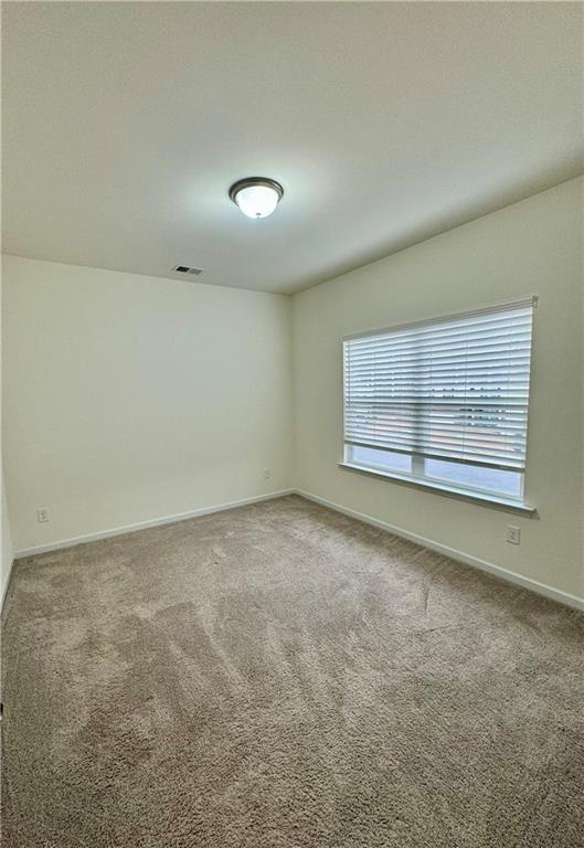 1628 Newport Dr, Bethlehem, GA 30620 - carpeted spare room with baseboards