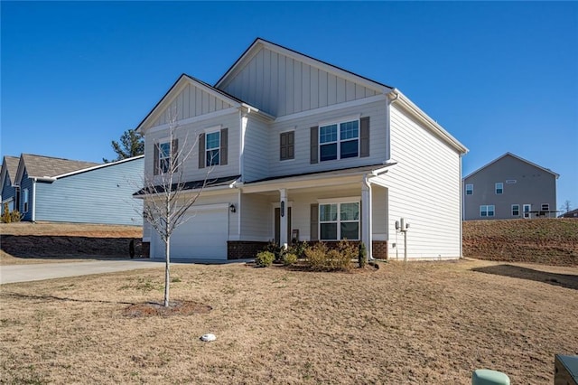 1628 Newport Dr, Bethlehem, GA 30620 - view of front of house with board and batten siding, driveway, a porch, an attached garage, and brick siding