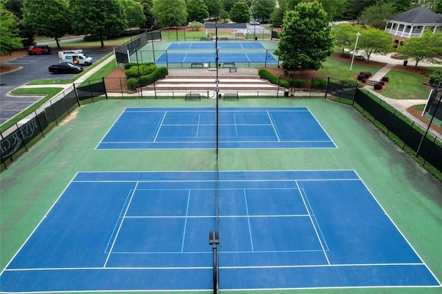 view of sport court with fence