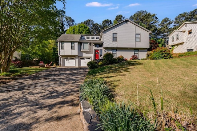 1189 Norfolk Dr NW, Acworth, GA 30102 - split level home with driveway, a front yard, and a garage