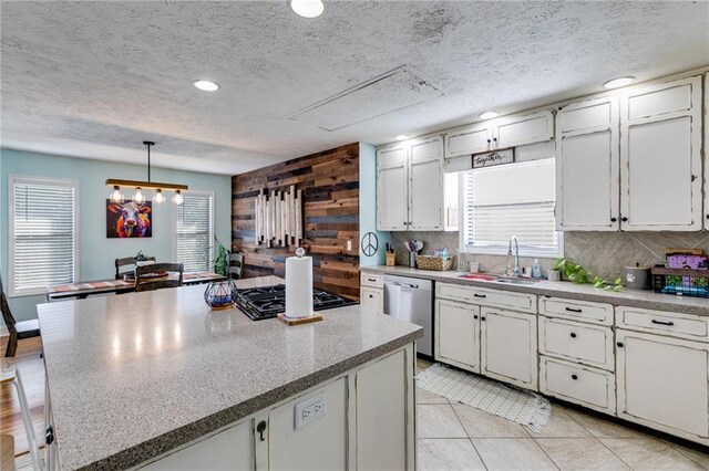 1189 Norfolk Dr NW, Acworth, GA 30102 - kitchen featuring a sink, gas stovetop, decorative backsplash, white cabinetry, and stainless steel dishwasher