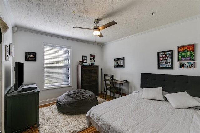 1189 Norfolk Dr NW, Acworth, GA 30102 - bedroom featuring ornamental molding, a textured ceiling, wood finished floors, and baseboards
