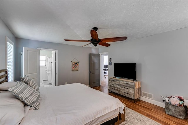 1189 Norfolk Dr NW, Acworth, GA 30102 - bedroom with a ceiling fan, visible vents, baseboards, wood finished floors, and ensuite bathroom