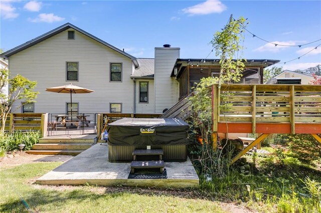 1189 Norfolk Dr NW, Acworth, GA 30102 - back of house featuring a deck, a patio, a chimney, and a hot tub