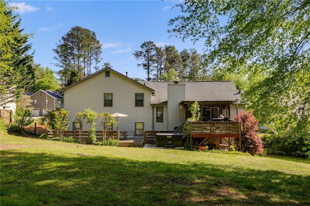 1189 Norfolk Dr NW, Acworth, GA 30102 - rear view of property with a chimney, a wooden deck, and a yard