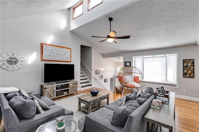 1189 Norfolk Dr NW, Acworth, GA 30102 - living area with ceiling fan, a healthy amount of sunlight, baseboards, a textured ceiling, and wood finished floors