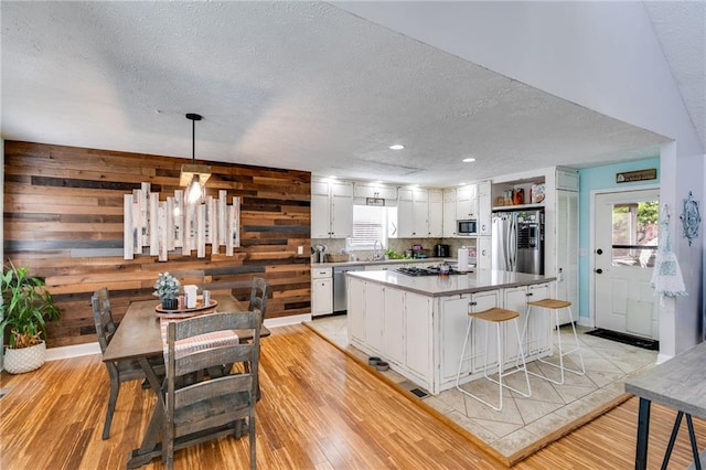 1189 Norfolk Dr NW, Acworth, GA 30102 - kitchen with a textured ceiling, white cabinetry, stainless steel appliances, and a sink