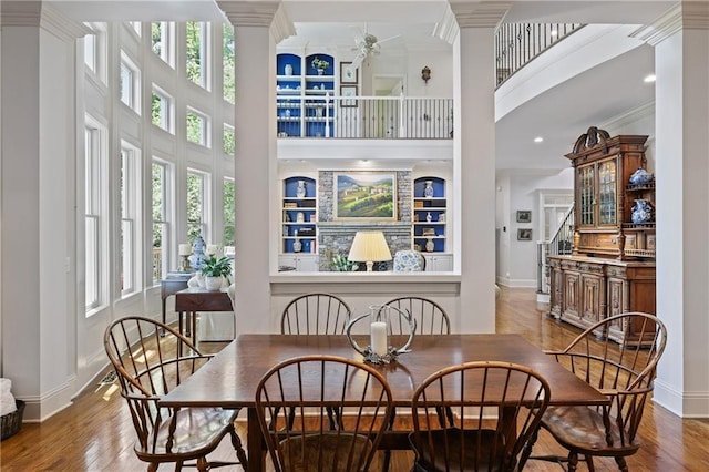 2630 Weddington Pl NE, Marietta, GA 30068 - dining space with a high ceiling, crown molding, wood finished floors, baseboards, and a ceiling fan