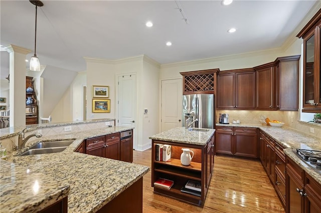 2630 Weddington Pl NE, Marietta, GA 30068 - kitchen with appliances with stainless steel finishes, a sink, an island with sink, light wood-style floors, and light stone counters