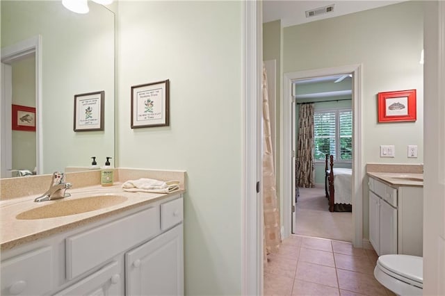 2630 Weddington Pl NE, Marietta, GA 30068 - ensuite bathroom with vanity, tile patterned flooring, toilet, and baseboards