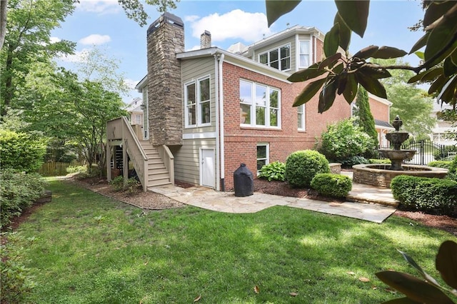 2630 Weddington Pl NE, Marietta, GA 30068 - rear view of house with brick siding, stairway, and a chimney