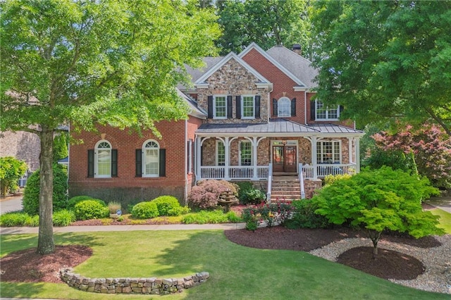 2630 Weddington Pl NE, Marietta, GA 30068 - view of front of property featuring covered porch, a front lawn, a chimney, and stairs