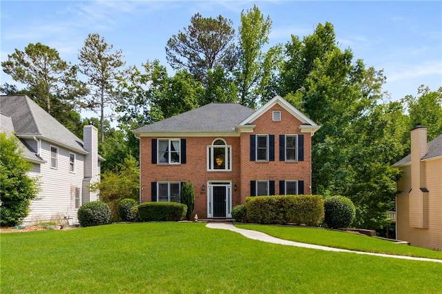1019 Legacy Walk, Woodstock, GA 30189 - colonial-style house with a front lawn and brick siding
