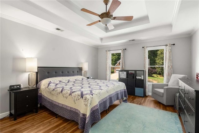 1019 Legacy Walk, Woodstock, GA 30189 - bedroom with a tray ceiling, wood finished floors, a ceiling fan, and crown molding