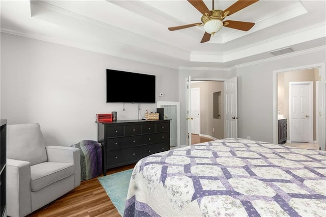 1019 Legacy Walk, Woodstock, GA 30189 - bedroom with a tray ceiling, crown molding, wood finished floors, and ceiling fan