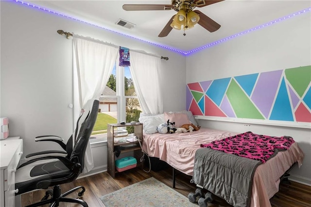 1019 Legacy Walk, Woodstock, GA 30189 - bedroom with an office area, wood finished floors, and a ceiling fan