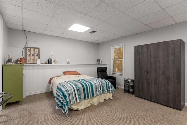 1019 Legacy Walk, Woodstock, GA 30189 - bedroom featuring carpet floors, a paneled ceiling, and a wainscoted wall