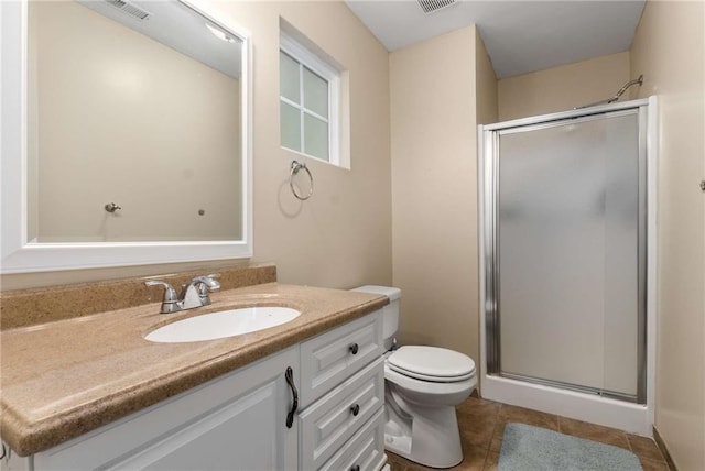 1019 Legacy Walk, Woodstock, GA 30189 - bathroom featuring a stall shower, tile patterned floors, vanity, and toilet