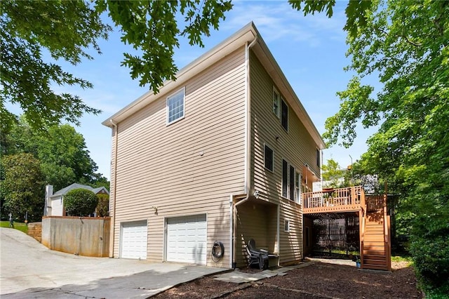 1019 Legacy Walk, Woodstock, GA 30189 - view of side of home with stairway, a deck, concrete driveway, and an attached garage