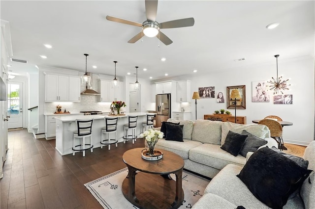 living area with a ceiling fan, dark wood-style floors, and recessed lighting