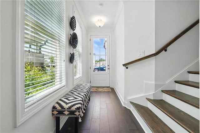 entryway with stairs, dark wood-style floors, and baseboards