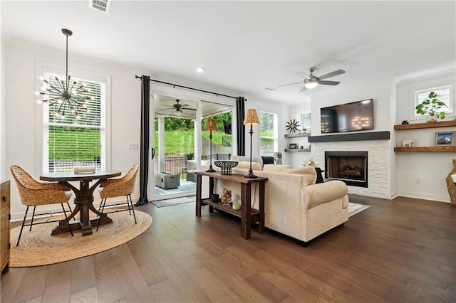 living area featuring a ceiling fan, dark wood-type flooring, a fireplace, recessed lighting, and baseboards