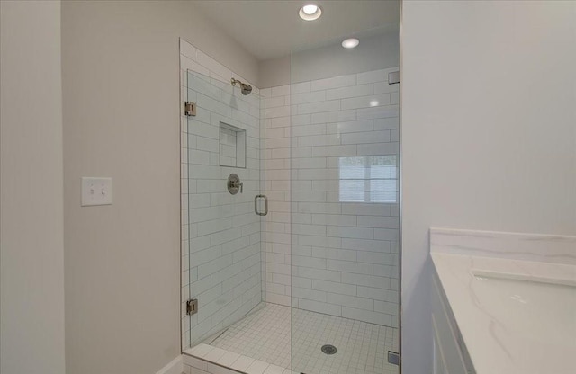 bathroom featuring vanity and an enclosed shower