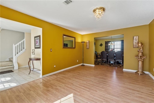 4450 Millenium View Ct, Snellville, GA 30039 - living area with stairway and light wood-style flooring