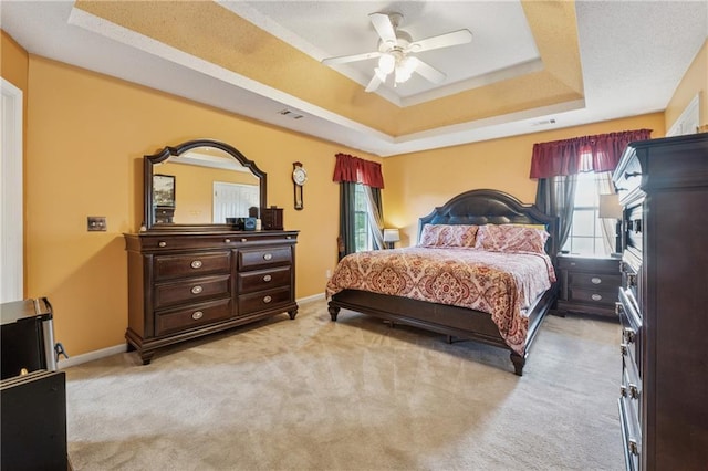4450 Millenium View Ct, Snellville, GA 30039 - bedroom featuring a raised ceiling, light carpet, and a ceiling fan