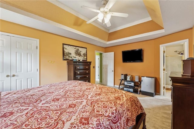 4450 Millenium View Ct, Snellville, GA 30039 - bedroom featuring light colored carpet, a closet, a raised ceiling, and ceiling fan