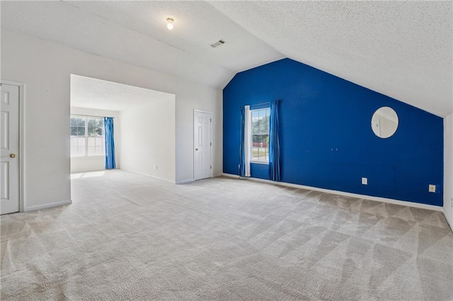 4450 Millenium View Ct, Snellville, GA 30039 - bonus room featuring carpet, vaulted ceiling, and a textured ceiling