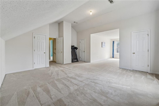 4450 Millenium View Ct, Snellville, GA 30039 - bonus room featuring lofted ceiling, light colored carpet, and a textured ceiling