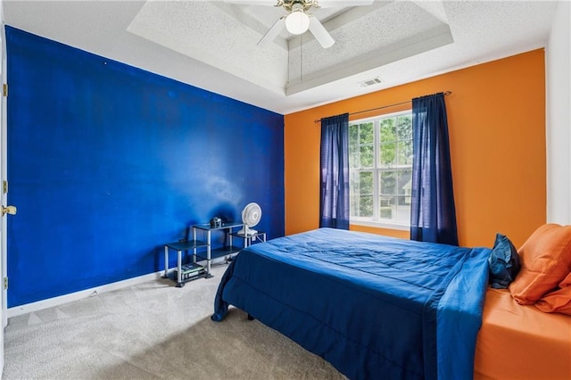4450 Millenium View Ct, Snellville, GA 30039 - bedroom featuring a raised ceiling, carpet flooring, a textured ceiling, and ceiling fan