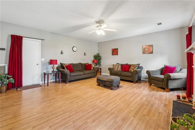 4450 Millenium View Ct, Snellville, GA 30039 - living area with light wood-style floors, a ceiling fan, and a textured ceiling