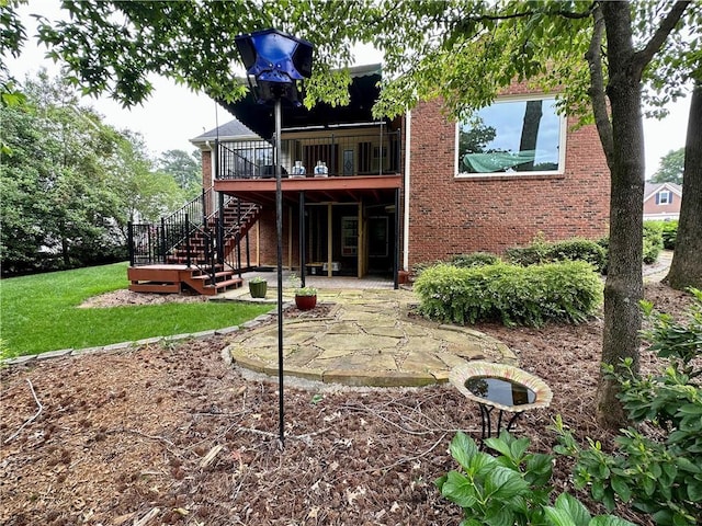 810 Doe Hill Ln, Roswell, GA 30075 - rear view of house featuring stairway, a patio, a deck, brick siding, and a yard