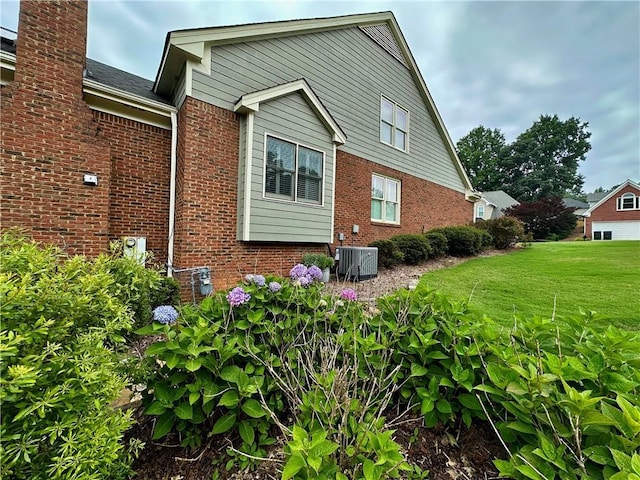 810 Doe Hill Ln, Roswell, GA 30075 - view of side of home with brick siding, a lawn, and a chimney
