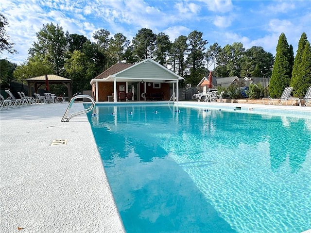 810 Doe Hill Ln, Roswell, GA 30075 - community pool featuring a gazebo, a patio area, and view of wooded area