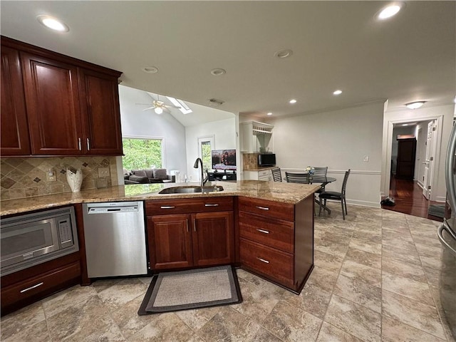 810 Doe Hill Ln, Roswell, GA 30075 - kitchen with appliances with stainless steel finishes, decorative backsplash, a peninsula, ceiling fan, and light stone counters