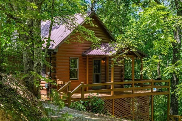 rear view of house with a deck