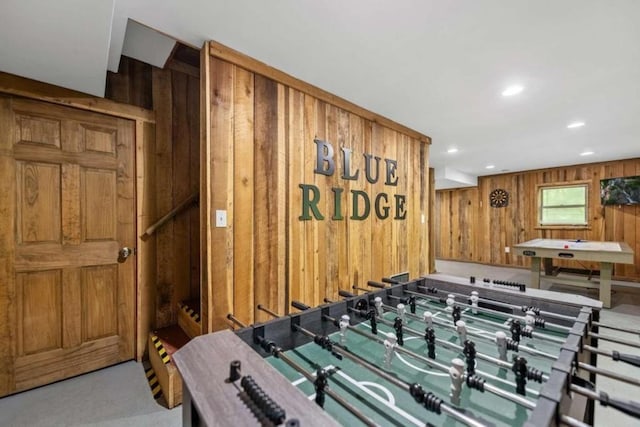 game room featuring wooden walls