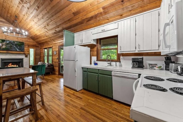 kitchen featuring wooden ceiling, green cabinets, wood walls, vaulted ceiling, and white appliances