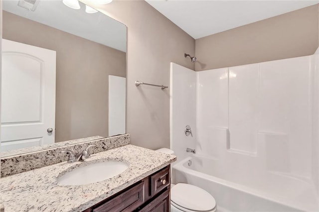 full bathroom with vanity, bathing tub / shower combination, and toilet